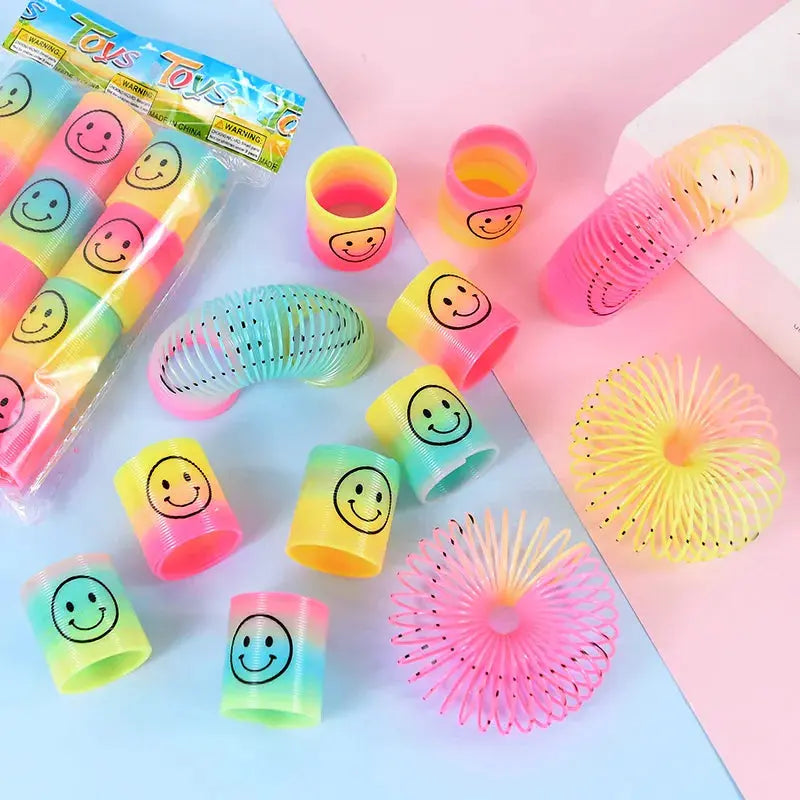 12Pcs Rainbow Magic Springs Circle Toys for Children Birthday Party Favors Giveaway Gifts Baby Shower Pinata Fillers Christmas - Baby World